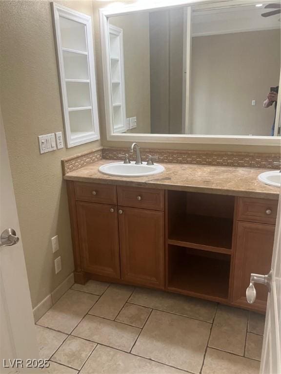 32 Via Vasari Unit 103, Henderson, NV 89011 - bathroom with double vanity, tile patterned flooring, and a sink