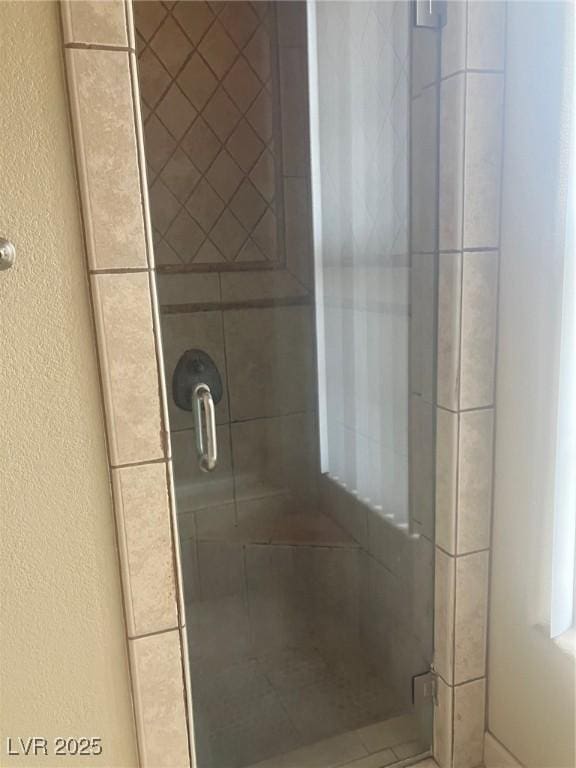 32 Via Vasari Unit 103, Henderson, NV 89011 - full bath featuring a textured wall and a shower stall