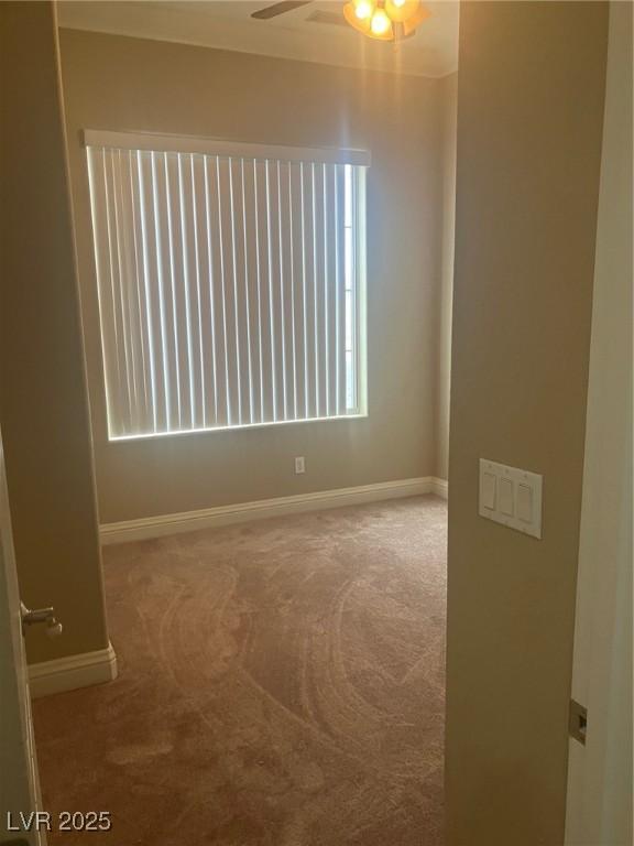 32 Via Vasari Unit 103, Henderson, NV 89011 - spare room with carpet, baseboards, and ceiling fan