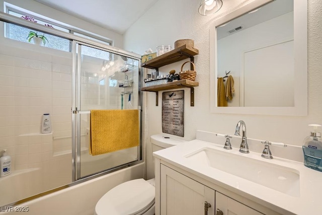 bathroom with vanity, toilet, enclosed tub / shower combo, vaulted ceiling, and visible vents