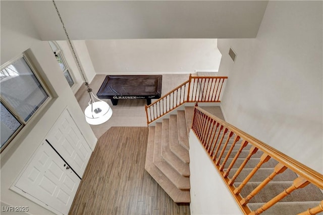 staircase featuring visible vents and baseboards