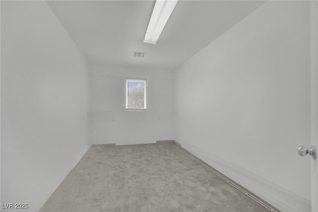 unfurnished room featuring carpet and visible vents