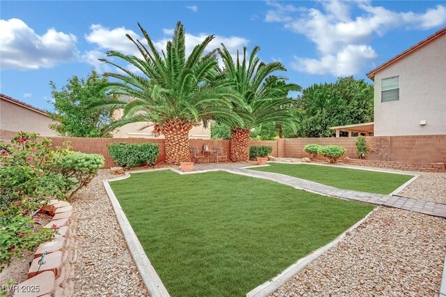 view of yard with a fenced backyard