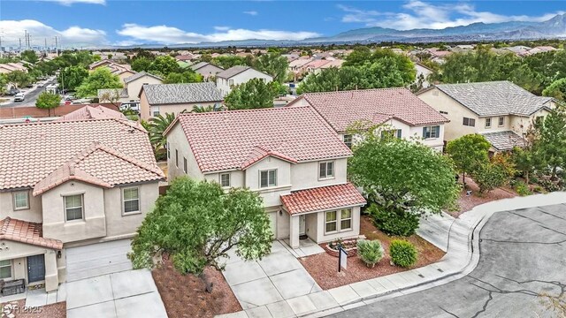 bird's eye view with a mountain view and a residential view