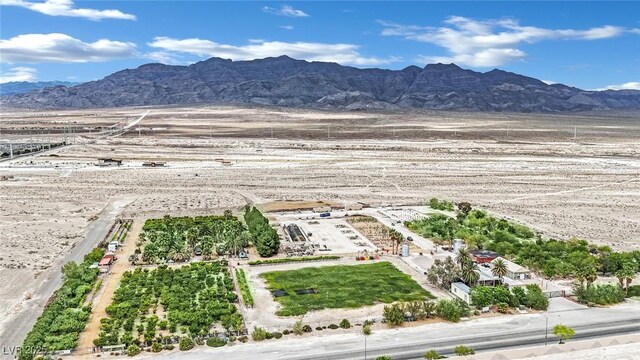 birds eye view of property with a mountain view and a rural view