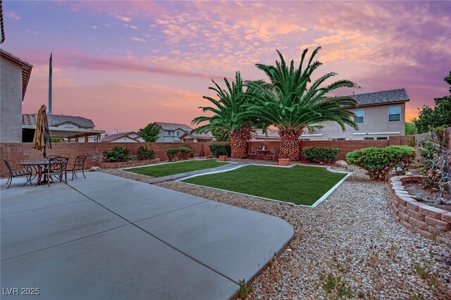 view of yard featuring a patio and a fenced backyard
