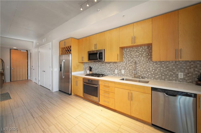 353 E Bonneville Ave Unit 215, Las Vegas, NV 89101 - kitchen featuring a sink, stainless steel appliances, backsplash, and light countertops
