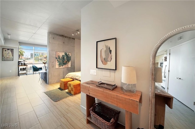 353 E Bonneville Ave Unit 215, Las Vegas, NV 89101 - hallway featuring a wall of windows and visible vents
