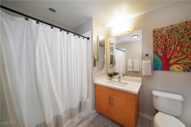 353 E Bonneville Ave Unit 215, Las Vegas, NV 89101 - bathroom with toilet, baseboards, tile patterned floors, and vanity