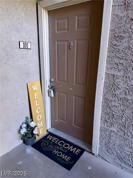4965 Indian River Dr Unit 101, Las Vegas, NV 89103 - view of exterior entry with stucco siding