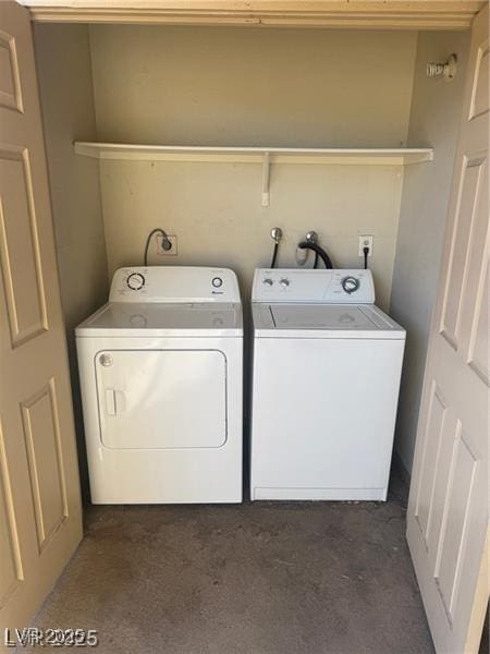 4965 Indian River Dr Unit 101, Las Vegas, NV 89103 - washroom featuring washing machine and clothes dryer, laundry area, and dark colored carpet