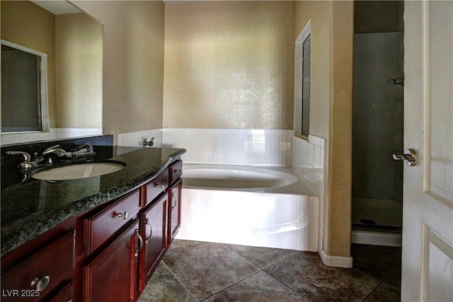 1608 Sussex St Unit 204, Las Vegas, NV 89144 - bathroom featuring a stall shower, tile patterned floors, a garden tub, and vanity
