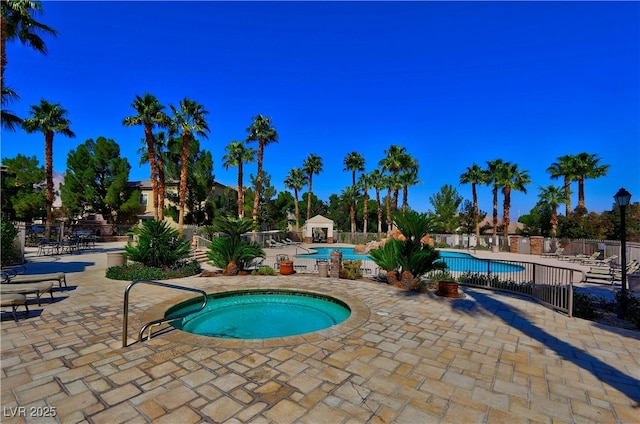 1608 Sussex St Unit 204, Las Vegas, NV 89144 - community pool with fence, a hot tub, and a patio area