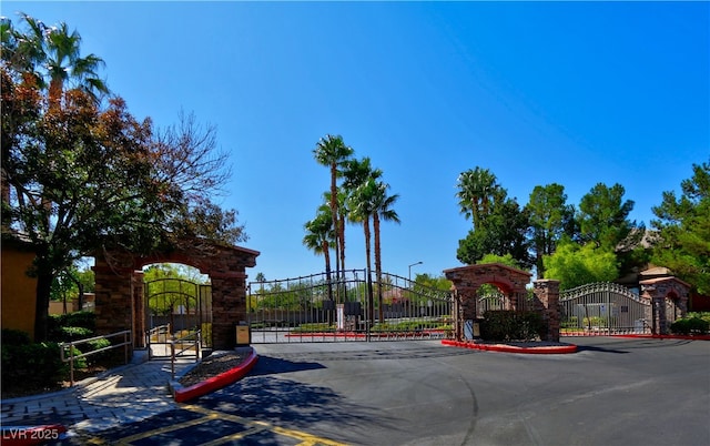 1608 Sussex St Unit 204, Las Vegas, NV 89144 - view of street featuring street lighting, a gate, a gated entry, and curbs