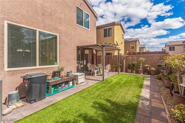 view of yard featuring a fenced backyard, a pergola, and a patio area