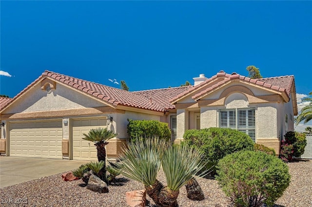 1574 Livingston Dr, Henderson, NV 89012 - mediterranean / spanish home with a garage, stucco siding, a tiled roof, and driveway