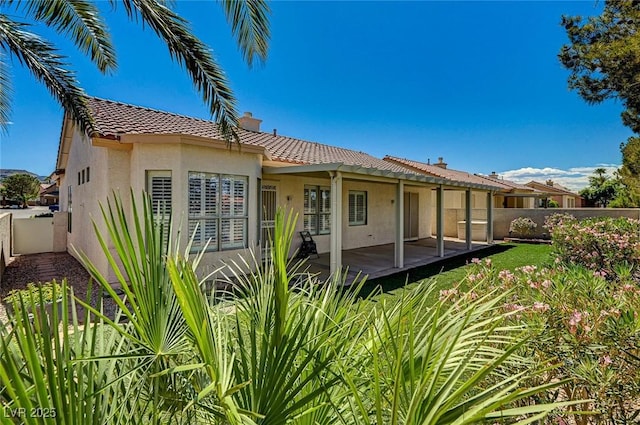 1574 Livingston Dr, Henderson, NV 89012 - back of house featuring stucco siding, a fenced backyard, a patio, and a tile roof