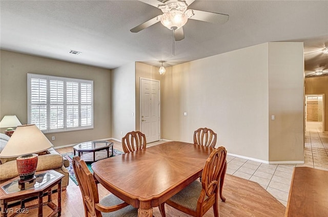 1574 Livingston Dr, Henderson, NV 89012 - dining space with light tile patterned floors and ceiling fan