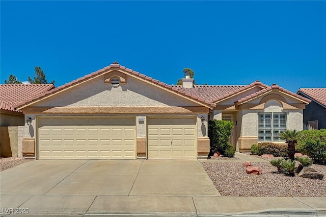 1574 Livingston Dr, Henderson, NV 89012 - mediterranean / spanish home featuring stucco siding, a garage, concrete driveway, a tiled roof, and a chimney