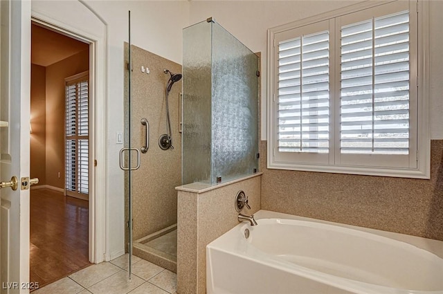 1574 Livingston Dr, Henderson, NV 89012 - bathroom featuring a garden tub, a shower stall, and tile patterned flooring
