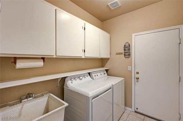 1574 Livingston Dr, Henderson, NV 89012 - washroom with cabinet space, washer and clothes dryer, and light tile patterned floors