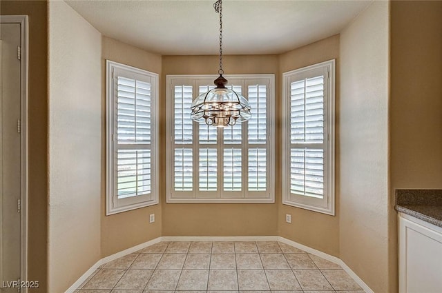 1574 Livingston Dr, Henderson, NV 89012 - unfurnished dining area featuring healthy amount of natural light, a chandelier, and light tile patterned floors