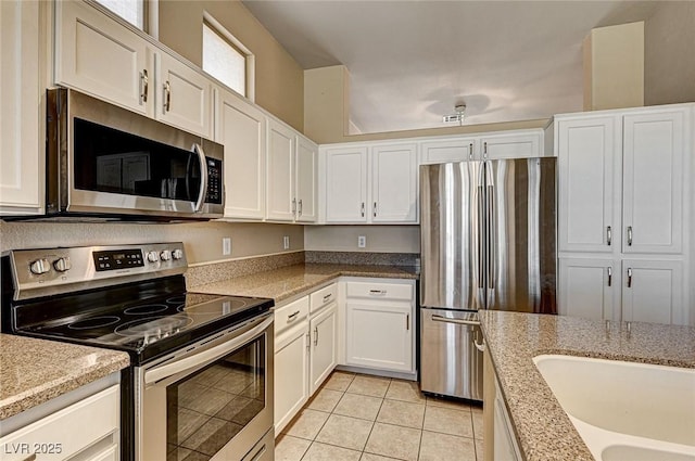 1574 Livingston Dr, Henderson, NV 89012 - kitchen featuring stainless steel appliances, white cabinetry, and light tile patterned flooring