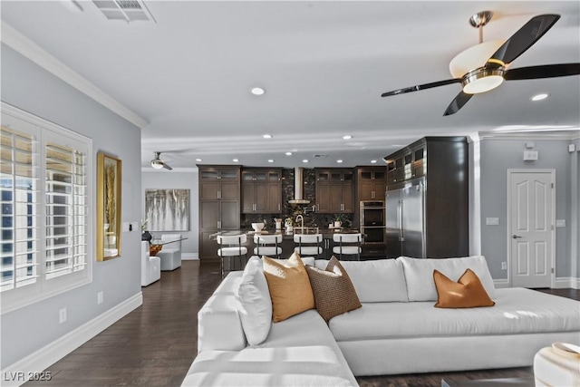 living room with recessed lighting, a ceiling fan, and baseboards