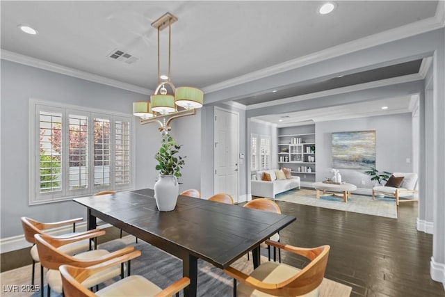 dining space featuring crown molding, an inviting chandelier, recessed lighting, and visible vents