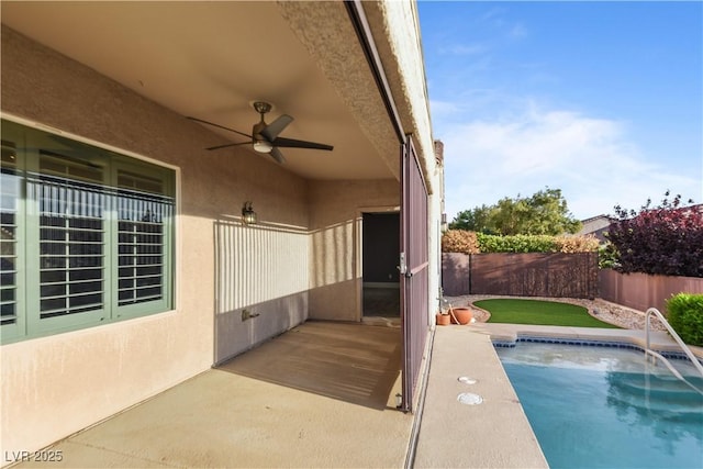 view of swimming pool featuring a patio, a fenced backyard, ceiling fan, and a fenced in pool