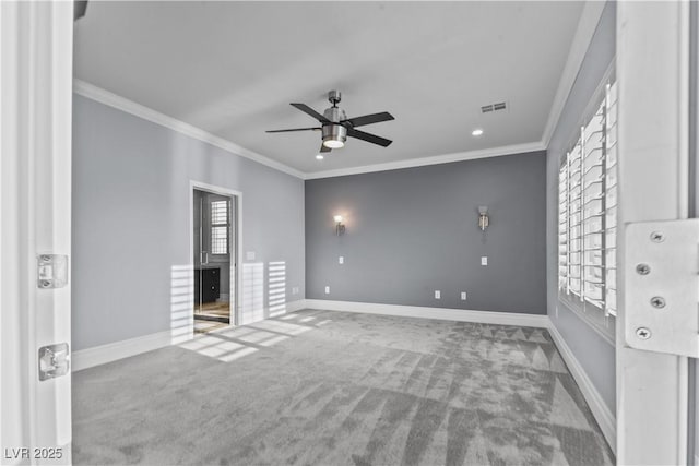 interior space featuring crown molding, a ceiling fan, carpet flooring, and visible vents