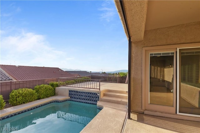 view of swimming pool with a fenced in pool and a fenced backyard