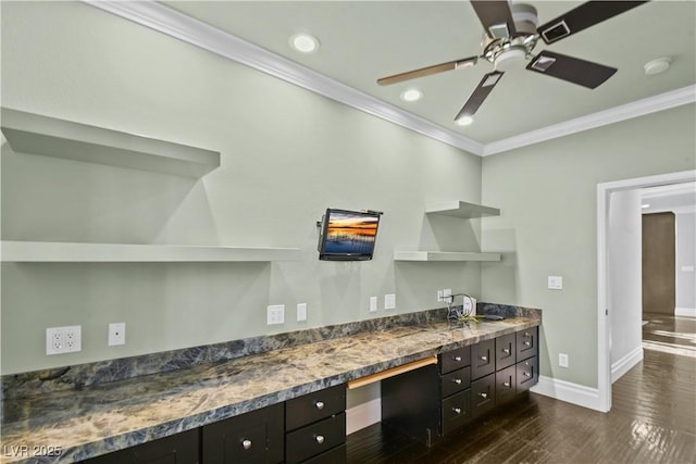 kitchen featuring open shelves, dark wood finished floors, a ceiling fan, baseboards, and ornamental molding