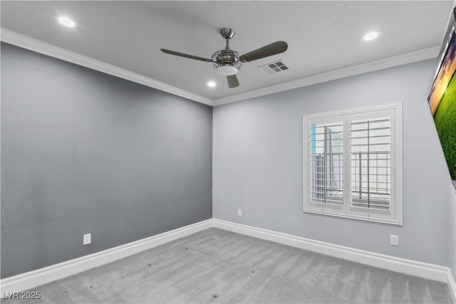 carpeted spare room with visible vents, recessed lighting, ceiling fan, and crown molding