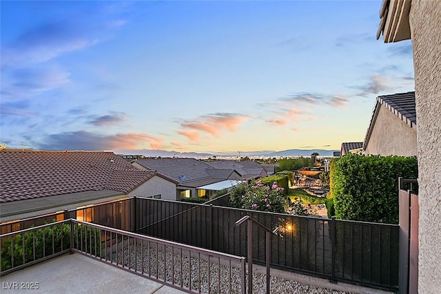 view of balcony at dusk