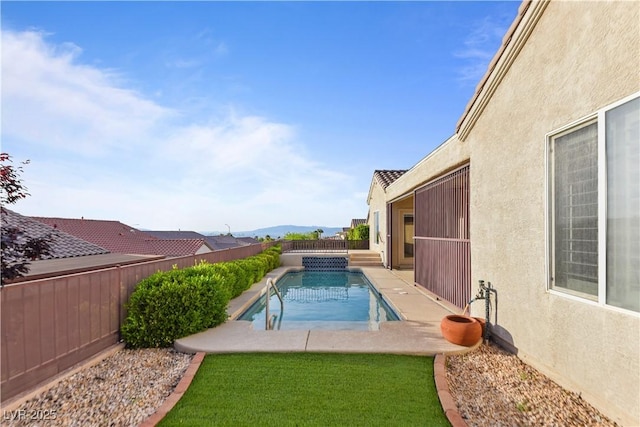 view of pool with a fenced backyard, a fenced in pool, and a patio