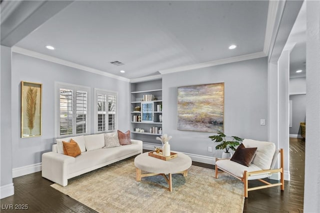 living area with visible vents, crown molding, wood finished floors, baseboards, and recessed lighting