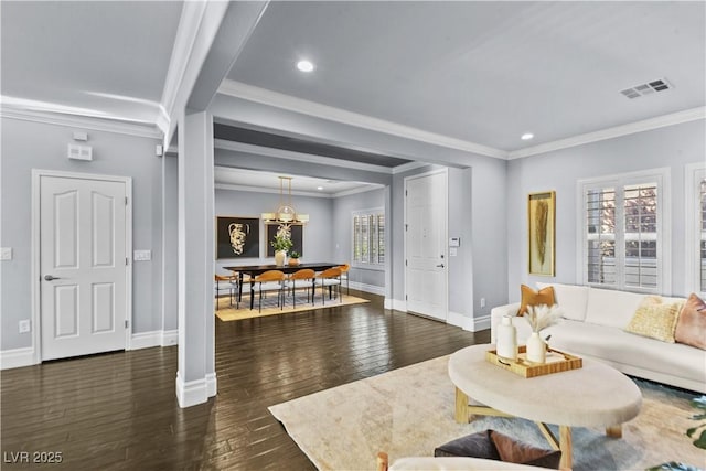 living area with visible vents, crown molding, baseboards, dark wood-style floors, and recessed lighting