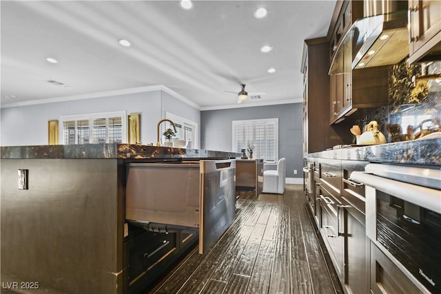 kitchen featuring recessed lighting, ceiling fan, ornamental molding, and dark wood-type flooring
