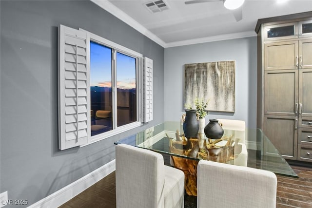 dining area featuring ceiling fan, visible vents, dark wood finished floors, baseboards, and ornamental molding