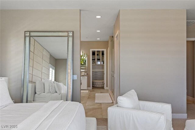 bedroom with recessed lighting and baseboards
