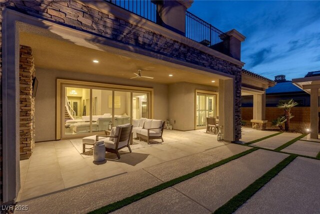 view of patio / terrace with fence, a balcony, and an outdoor hangout area