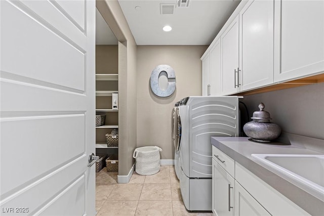 2 Olympia Outlook Dr, Las Vegas, NV 89141 - laundry area with cabinet space, washing machine and clothes dryer, and light tile patterned floors