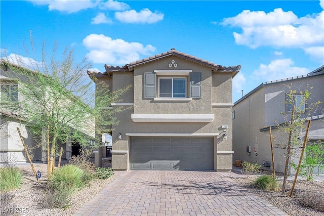 5252 Sunstone Mesa Dr, Las Vegas, NV 89166 - traditional-style house with an attached garage, decorative driveway, stucco siding, and a tiled roof