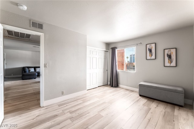 5020 Indian River Dr Unit 424, Las Vegas, NV 89103 - bedroom with a closet, baseboards, visible vents, and light wood-style floors
