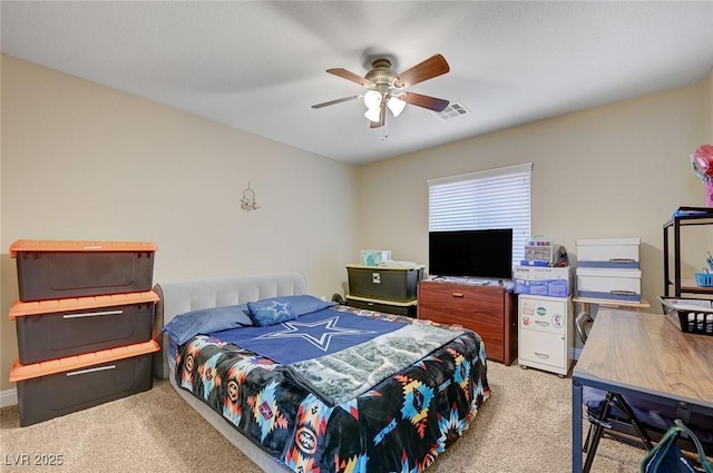 carpeted bedroom with a ceiling fan and visible vents