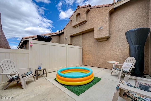 view of patio with fence