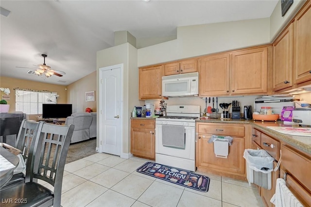 kitchen with ceiling fan, white appliances, light countertops, open floor plan, and light tile patterned floors