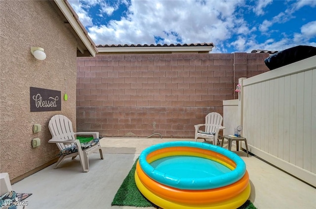 view of patio / terrace with fence