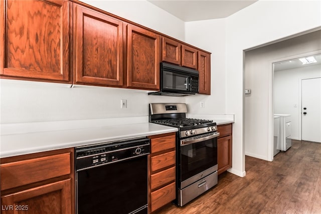 10029 Netherton Dr, Las Vegas, NV 89134 - kitchen with separate washer and dryer, light countertops, dark wood-type flooring, and black appliances